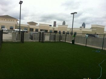 A green lawn in front of a building. at West Inman Lofts Apartments, Atlanta, GA